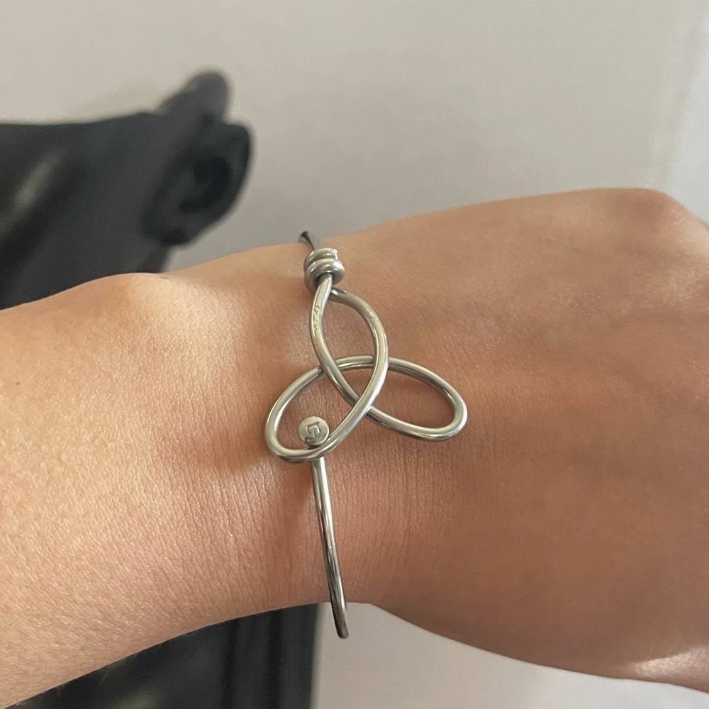 Silver tone trinity bangle bracelet